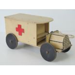 A vintage toy wooden pull along Military ambulance,