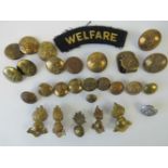 A small quantity of brass buttons, badges and insignia, together with a 'welfare' cloth badge.
