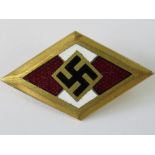 A WWII German enamelled Hitler Youth Honour badge.