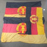 Three East German flags.