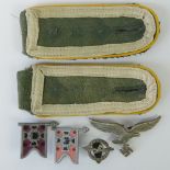 A pair of WWII German Luftwaffe shoulder boards, a cap eagle,