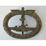 A WWII German U-boat 'gold' badge marked 'Schwerin..?'.