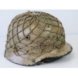 A fine reproduction WWII German Infantry helmet having single decal,