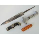 A WWII SS steel dagger blade engraved 'Meine Ehre Heisst Treue' blade measuring 22cm in length,