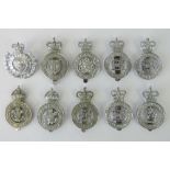 Ten police cap badges bearing Kings and