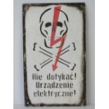 An enamel warning sign in Polish (Do Not