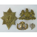 Four military badges including a Marines