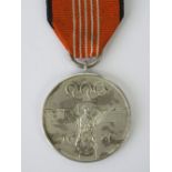 A 1936 German Olympics medallion with ri