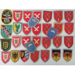 Thirty-one post-war German cloth badges