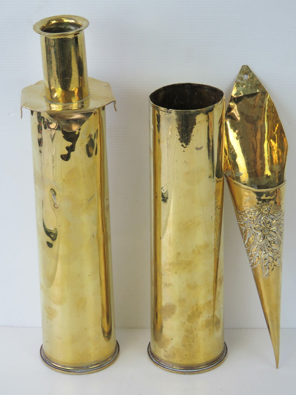A pair of brass shell cases each bearing