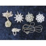 Four floral filigree pendants one marked