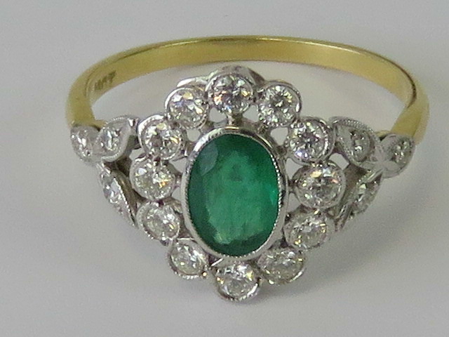 A delightful 18ct gold emerald and diamo