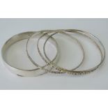 A set of two Sterling silver bangles, to