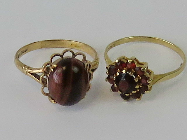 Two 9ct gold rings; one having garnet da