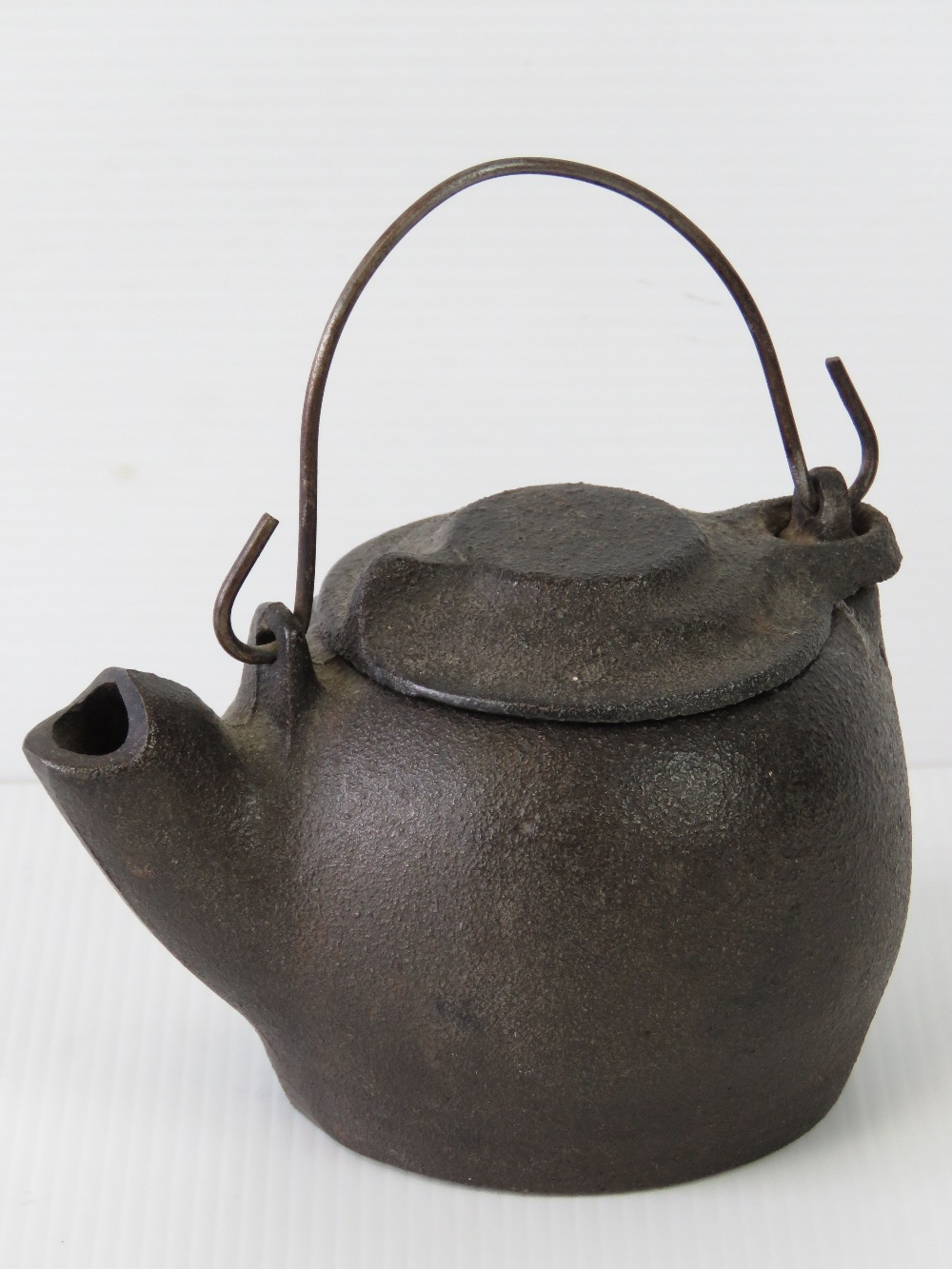 An antique cast bronze Oriental kettle w