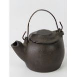 An antique cast bronze Oriental kettle w