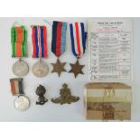 A collection of WWII medals and badges i