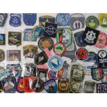 Fifty assorted cloth police badges.