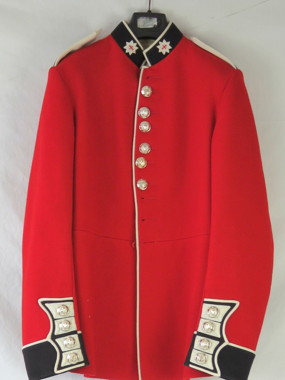 A Coldstream Footguards red tunic with l