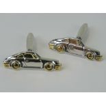A pair of cufflinks in the form of Porsche 911 sports cars.