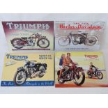 Four contemporary tin plate embossed signs, three for Triumph and one for Harley Davidson.