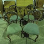 Four mahogany 19th century balloon back dining chairs with matching upholstery.