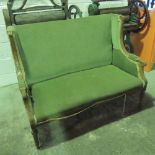 An Edwardian two seater oversprung salon settee 126cm wide. For re upholstery.