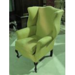 A recently recovered wing back armchair with fitted loose cushion.