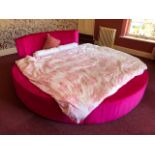 A very large and impressive 'circular' bed comprising standard king-size bed with extra rounded