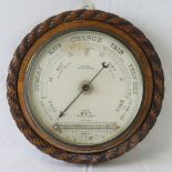 A delightful Victorian aneroid circular wall barometer complete with thermometer,