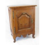 A French pine bedside cupboard enclosed by a single panelled door, 50cm wide, 67cm high.