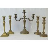 A brass candelabra having three sconces, standing 35cm high.