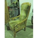 A mahogany framed open arm high back drawing room chair.