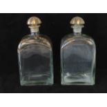 A pair of Georgian style gilded liquor bottles marked for Jerez Spain. each standing 21cm high.