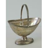 A delightful HM silver bonbon dish of pierced form with swag decoration and loop handle over,