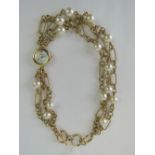 An Anne Klein double wrap bracelet watch having mother of pearl dial.