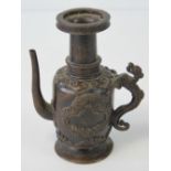 A 19th century Oriental teapot (lid deficient) in bronzed brass, 12cm high, 484g.