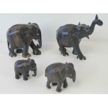 A set of four graduated ebony elephants, a/f.