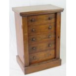 A fine specimen Wellington chest of drawers comprising five drawers with lockable hinged sides,