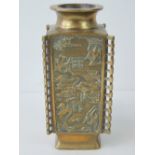 A late 19thC Chinese square section brass vase, with panels of storks in relief and Taoist symbols,