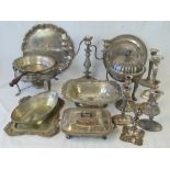 A quantity of assorted silver plated serving trays, tureens, stands, candlesticks, etc.