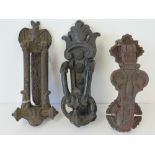 Three vintage cast iron door knockers one having letters slot and bat over.