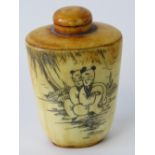 A late 19th / early 20th century Oriental bone scent bottle decorated with figures to one side with