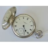A silver top wing full hunter pocket watch with American Waltham USA 'Traveler' movement,