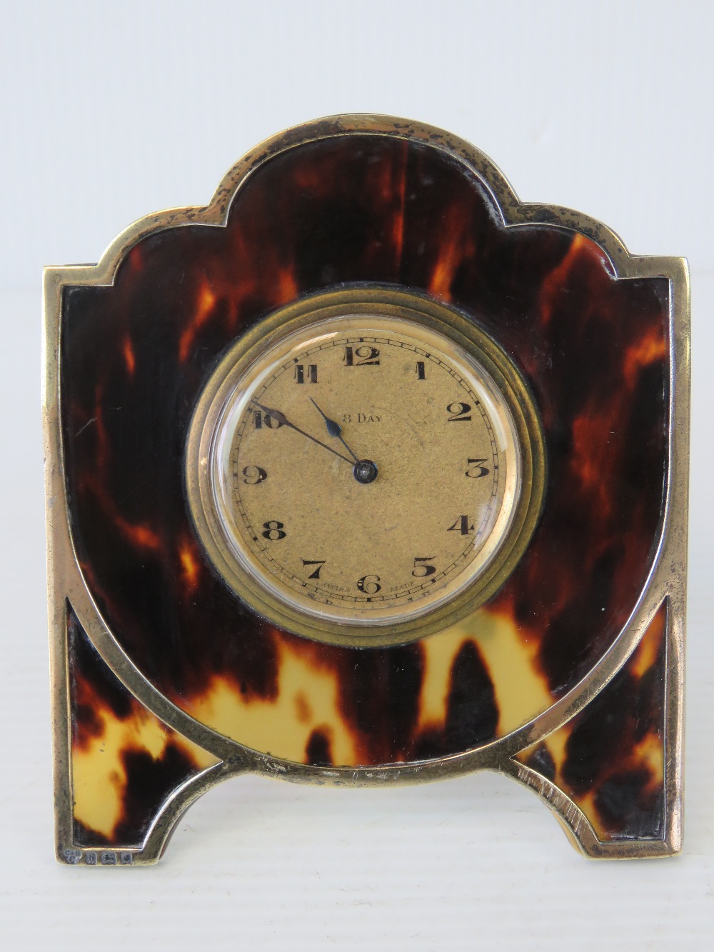 A delightful Art Deco HM silver and tortoiseshell freestanding easel desk clock made by Charles &