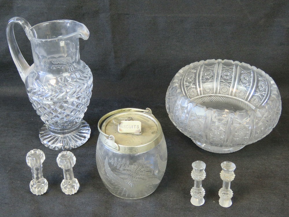 A cut glass punch bowl together with a cut glass jug standing 28cm high,