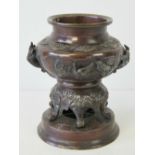 A 19th century Oriental censer on integral six legged stand over circular base,