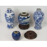 A Chinese blue and white baluster vase painted with floral panels, 23cm high,