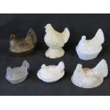 Four moulded glass 'hen on basket' egg dishes with covers, a hen lid,