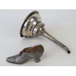 A delightful 19th century steel pin cushion in the form of a ladies heeled shoe,